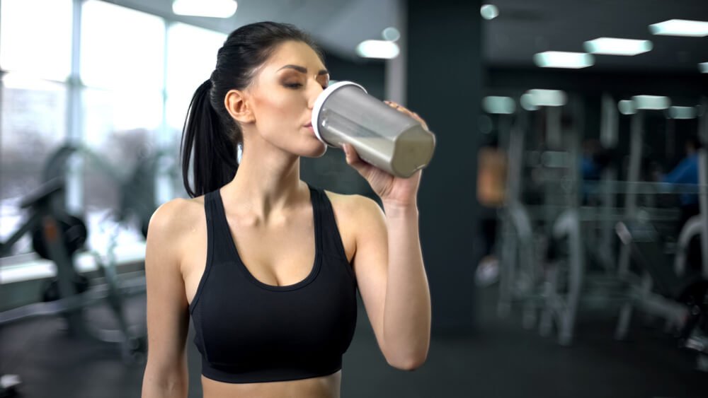 Woman Drinking Protein Shake After Exercise