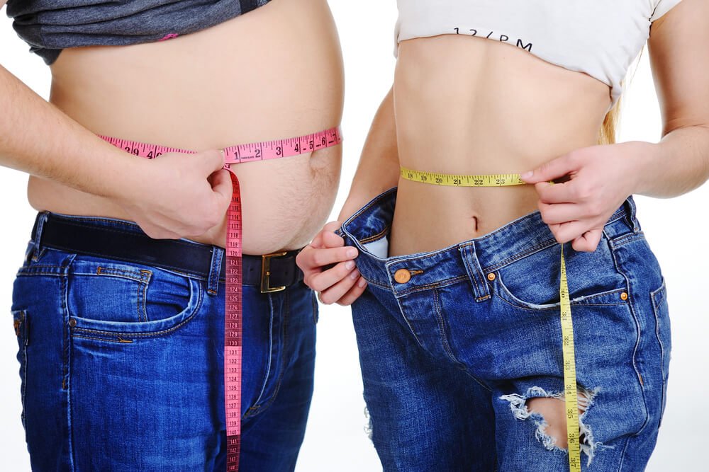 men and women measuring their belly with tape measure
