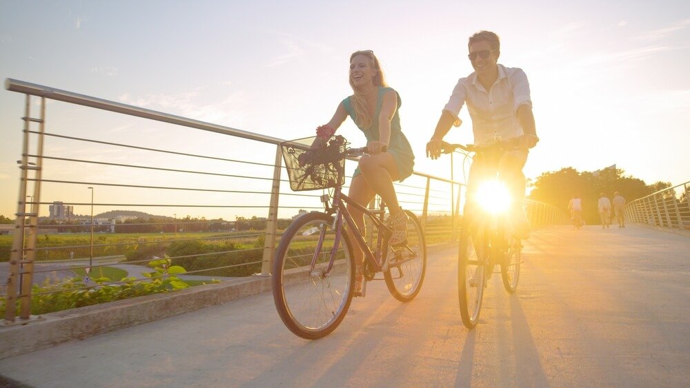 two men and women riding bicycles
