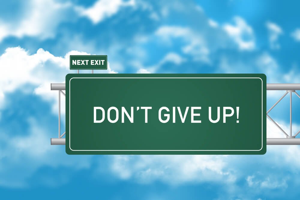 Road Sign Showing Don't Give Up!