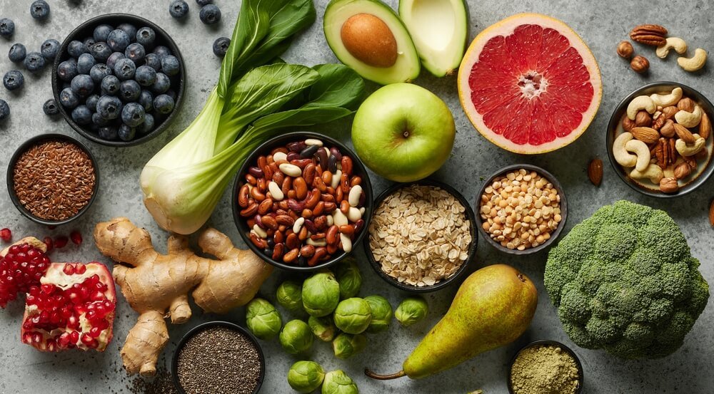 many kinds of fruit and nuts on the table